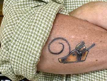 Finger plane tattoo on David Van Zandt's arm